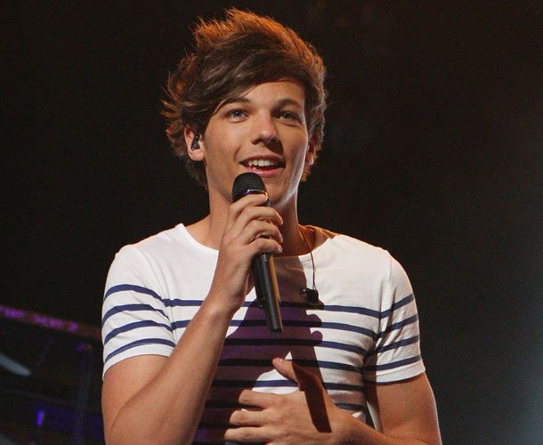 Louis Tomlinson adds his former band&#39;s name to the One Direction tattoo collection