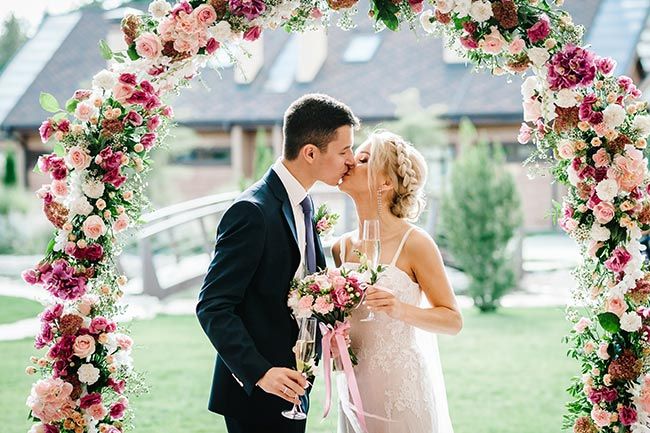bride-and-groom-flower-arch