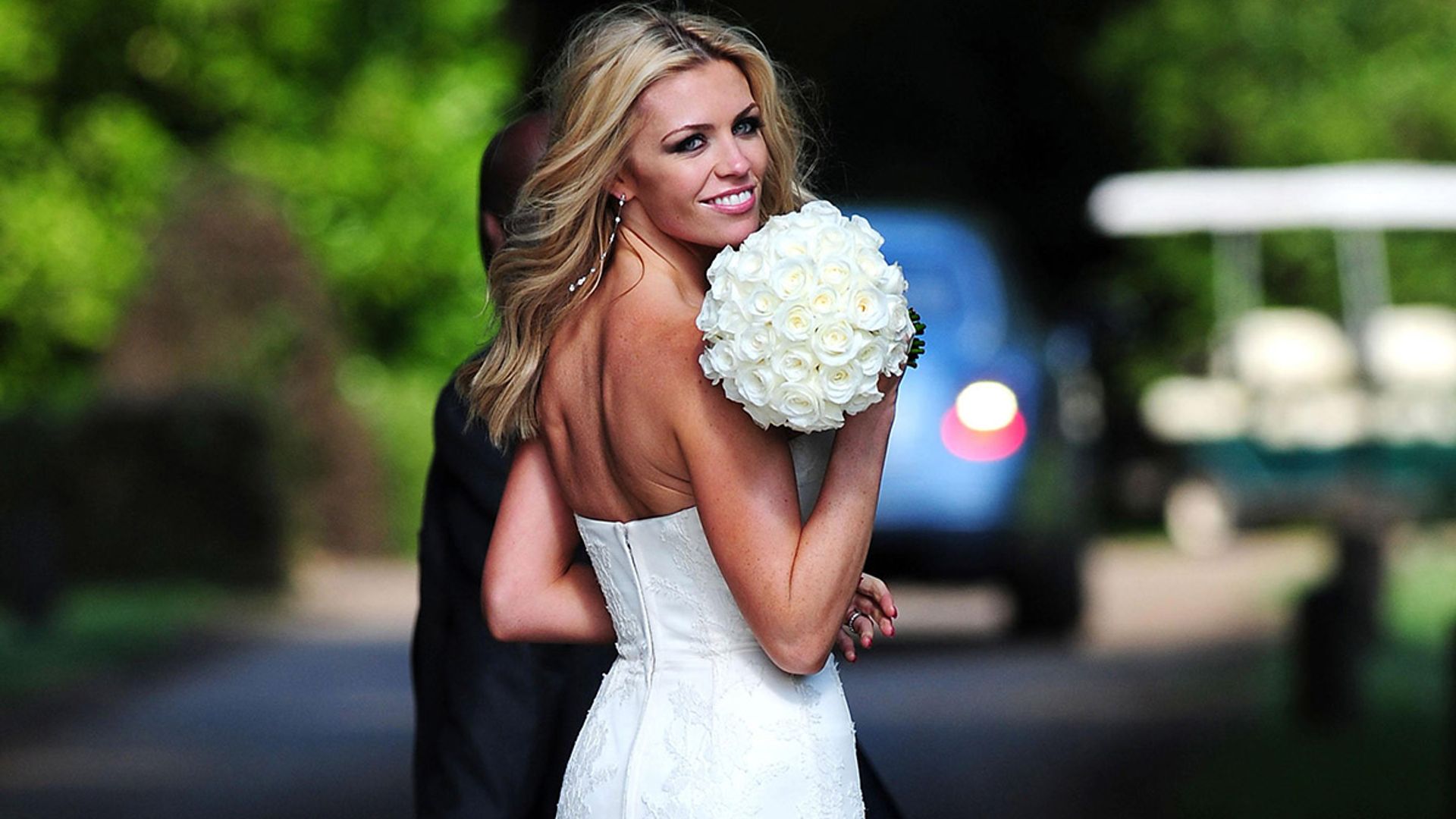 Abbey Clancy dons her wedding dress as she celebrates 9th wedding anniversary with Peter Crouch