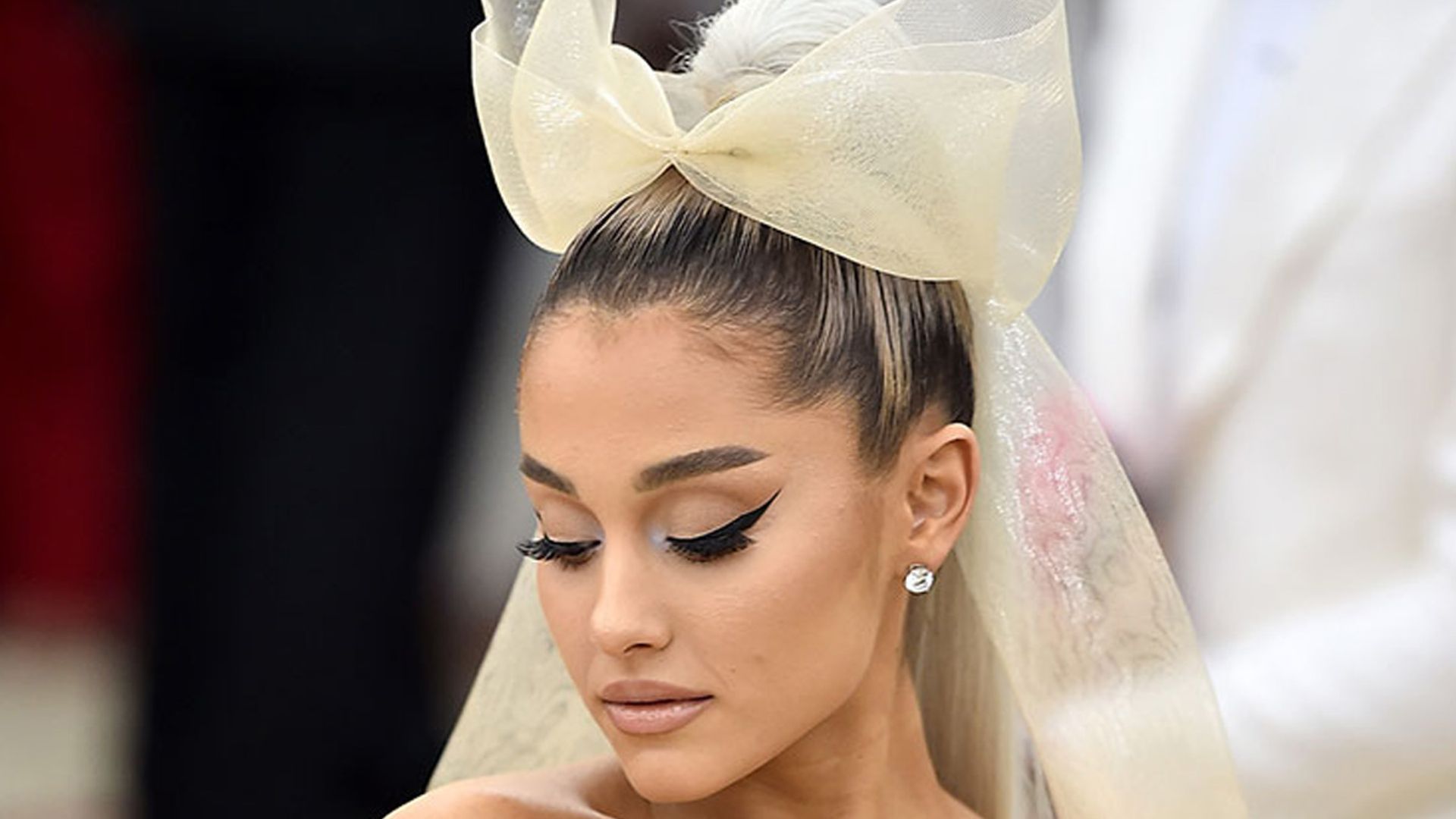Ariana Grande divides fans with risque bridesmaid outfit at brother's wedding