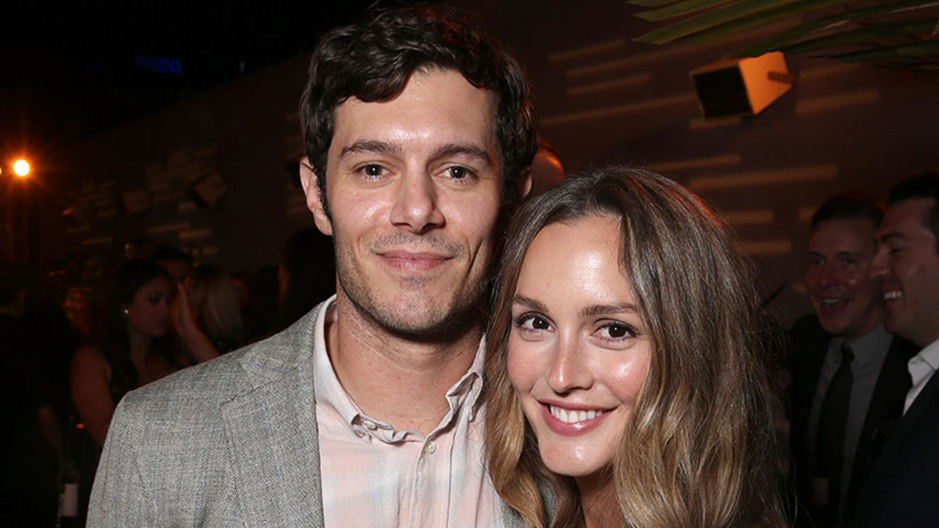 Leighton Meester and Adam Brody cuddle up during rare public outing together