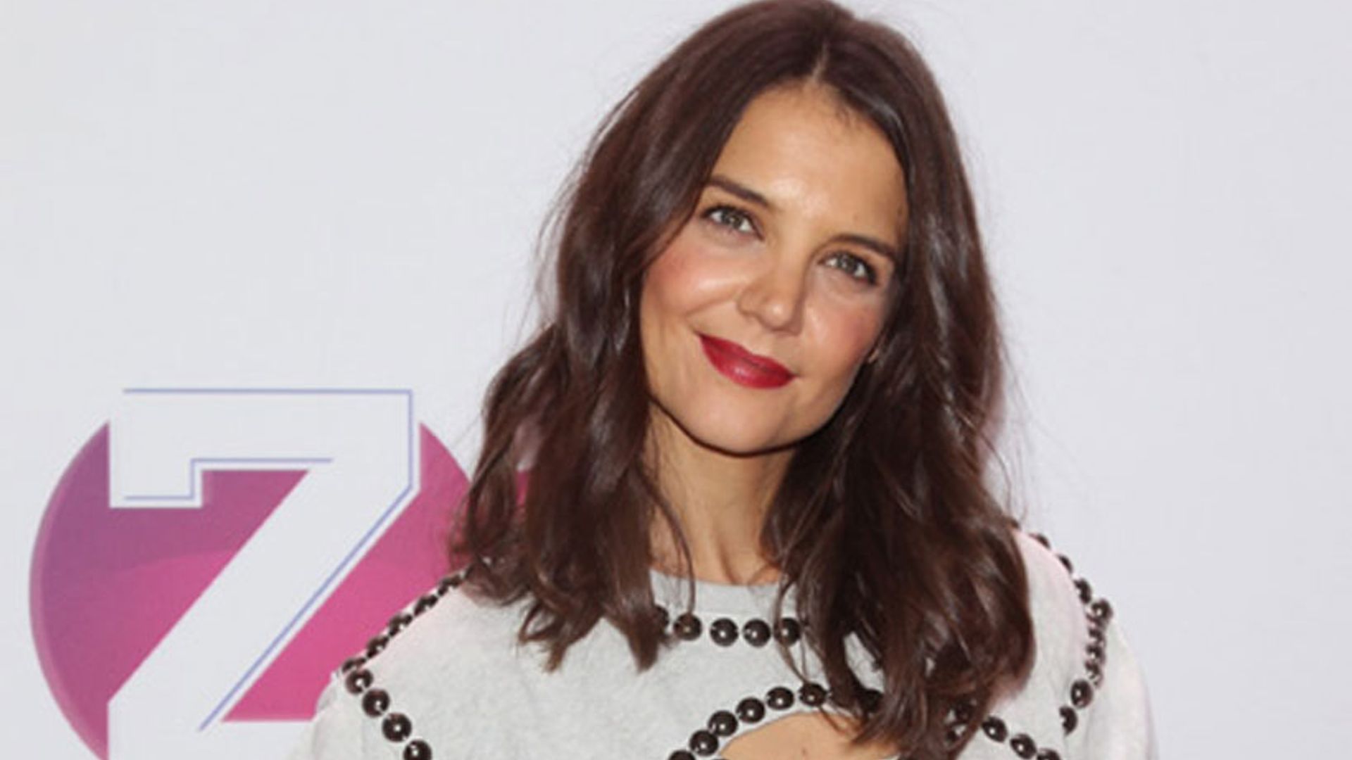 katie holmes presenting red dress fashion show backstage 