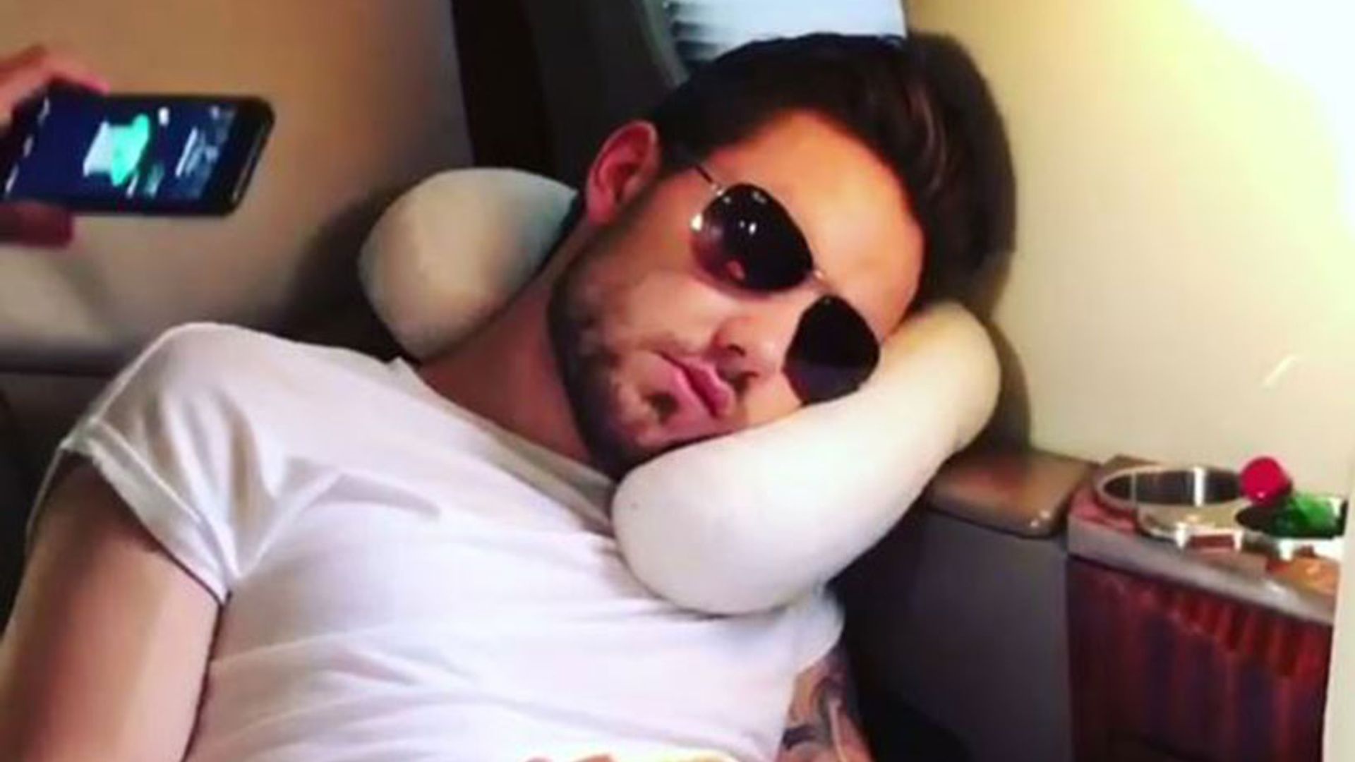 Liam Payne shows off his funny side on private plane after leaving Cheryl and baby Bear at home