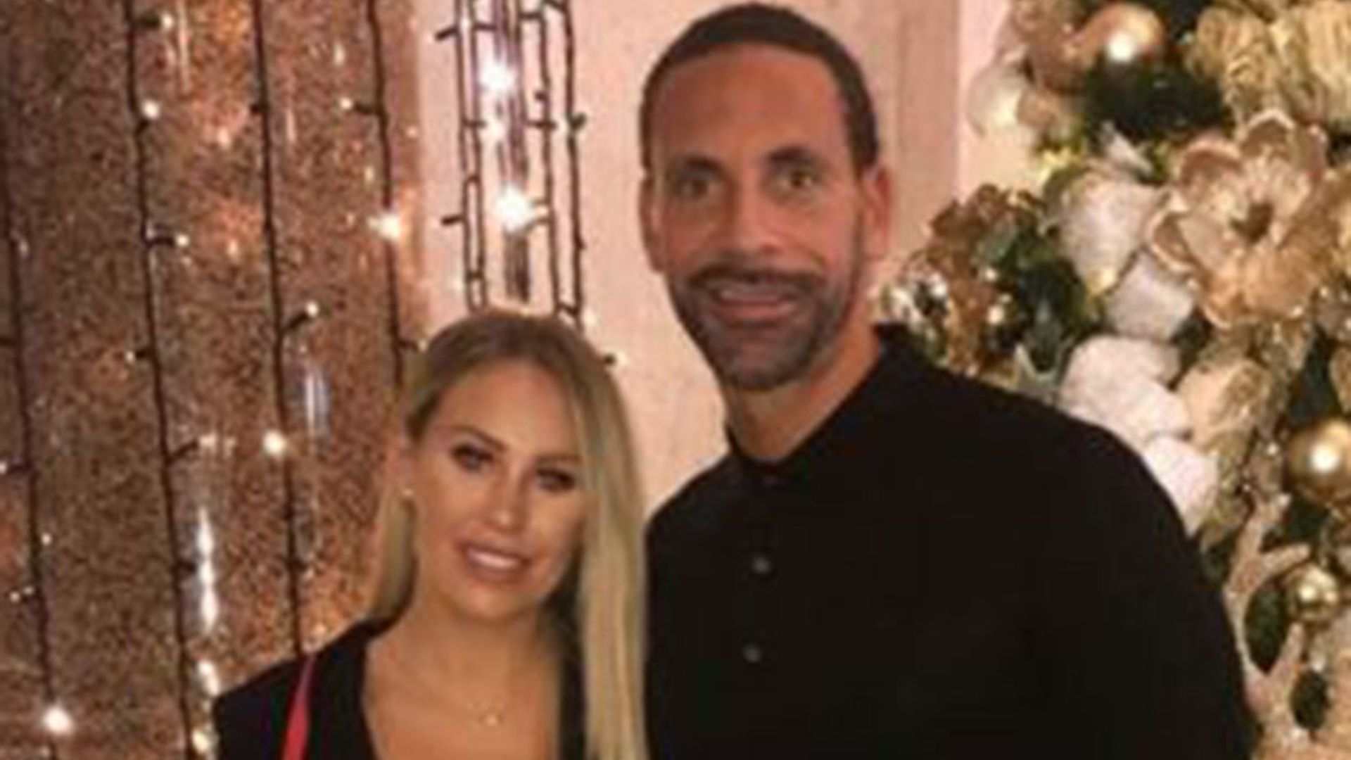 Rio Ferdinand and Kate Wright cosy up for a festive snap during romantic date night