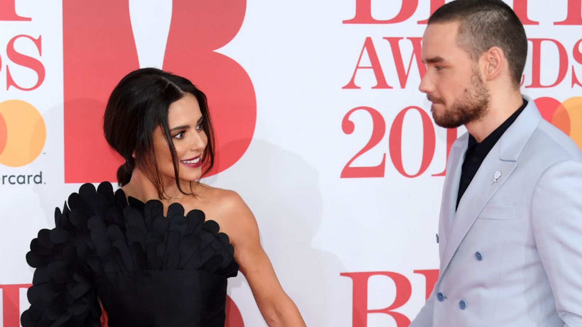 Cheryl and Liam Payne hold hands on red carpet at Brit Awards