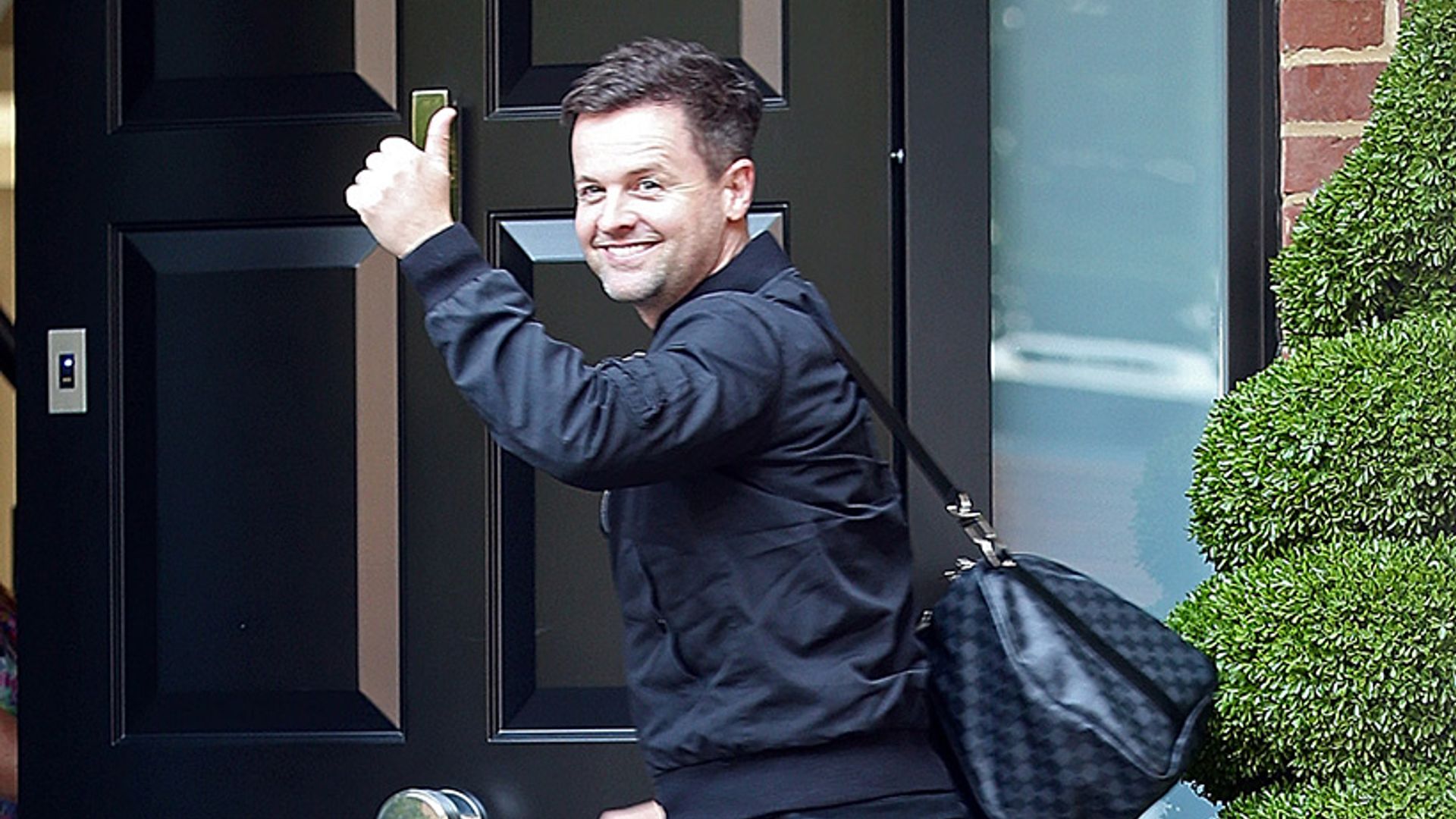 New dad Declan Donnelly is all smiles as he returns home after baby daughter's birth