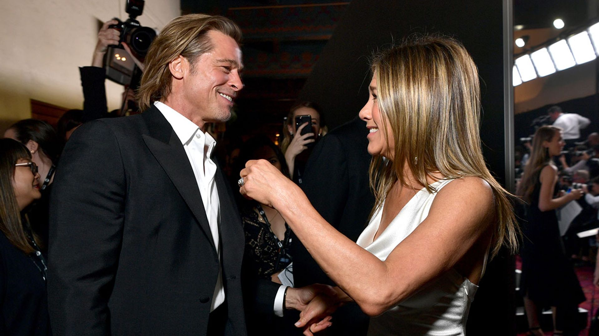 Brad Pitt and Jennifer Aniston reunite with sweet embrace - and Hollywood goes into meltdown!