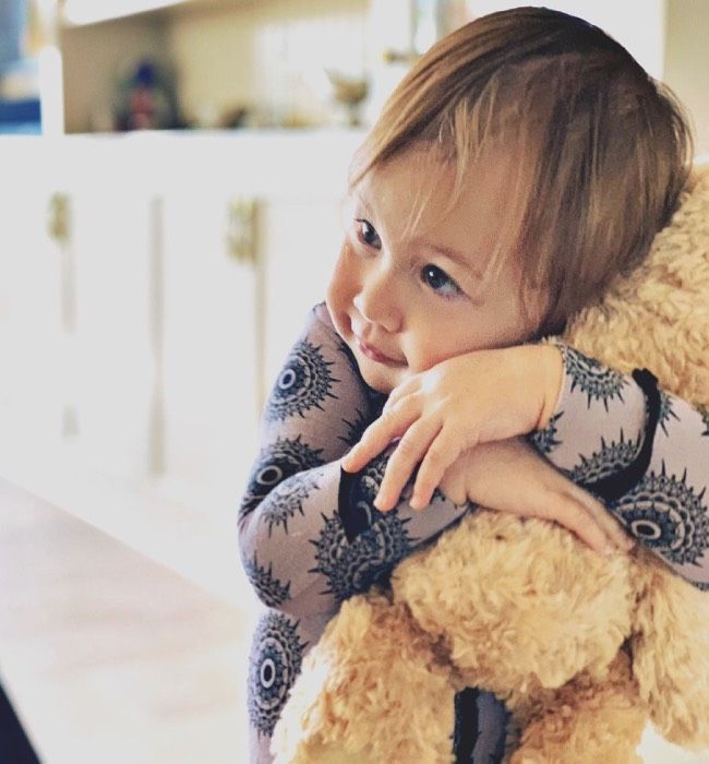 Kate Hudson's daughter Rani hugs a teddy bear