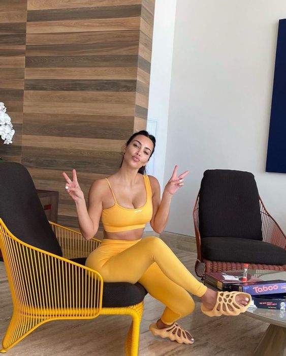 kim kardashian yeezy slides yellow workout bra leggings