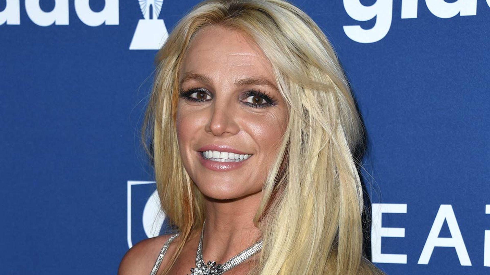 Britney Spears wows in neon swimsuit and pink hair transformation