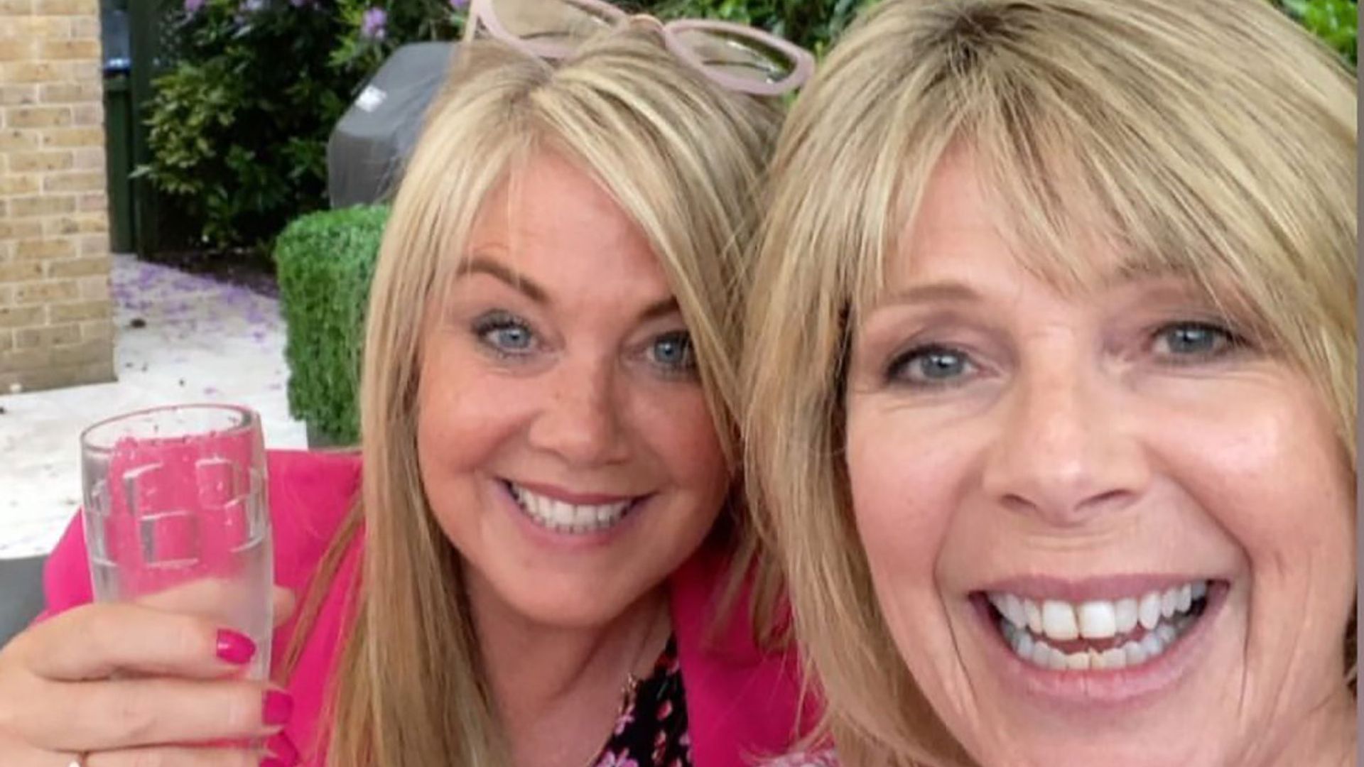 Ruth Langsford and Lucy Alexander twin in pink as they enjoy champagne date in gorgeous garden