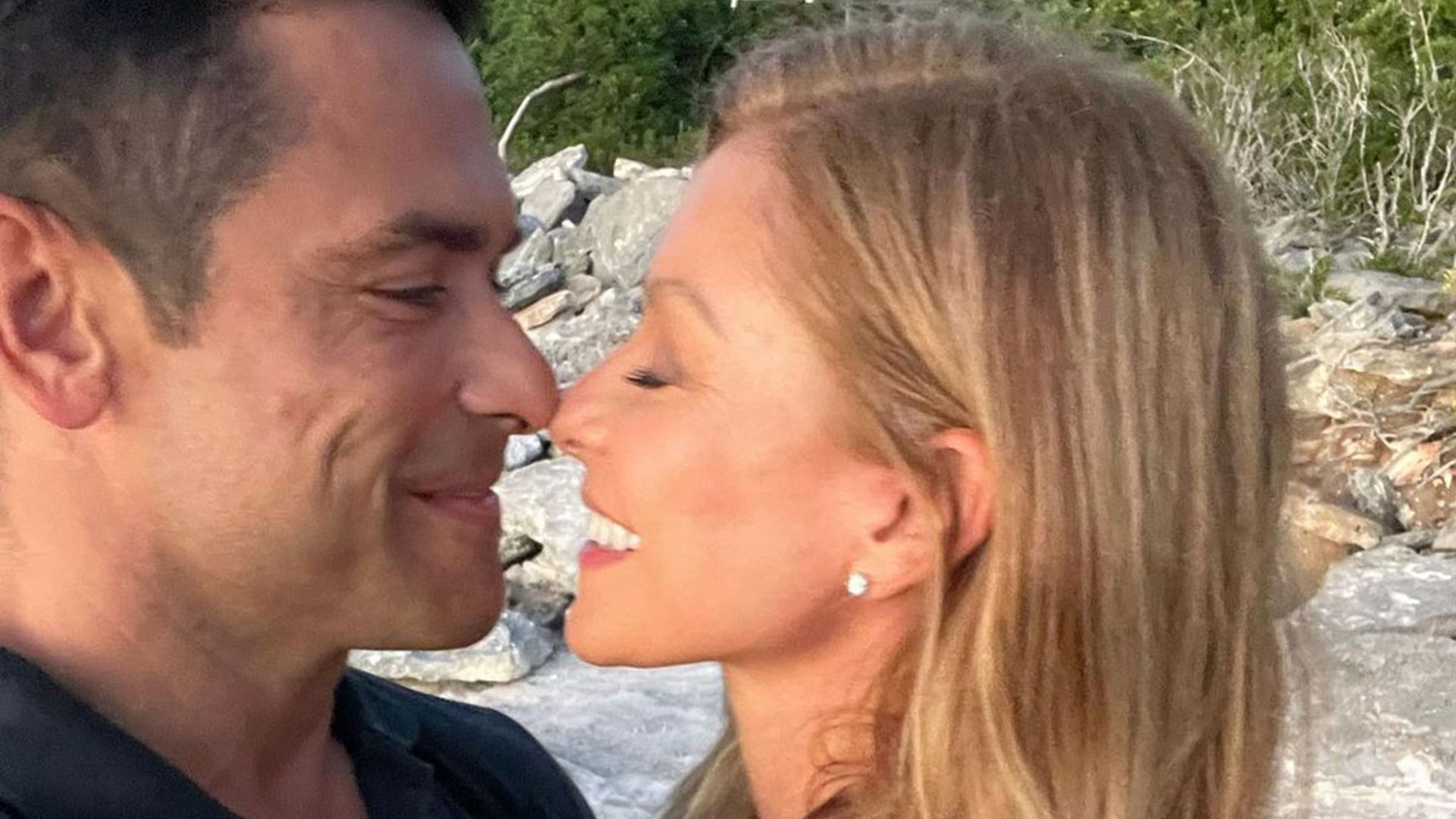 Kelly Ripa is unrecognisable as she dons mini white dress for incredible couple's photo