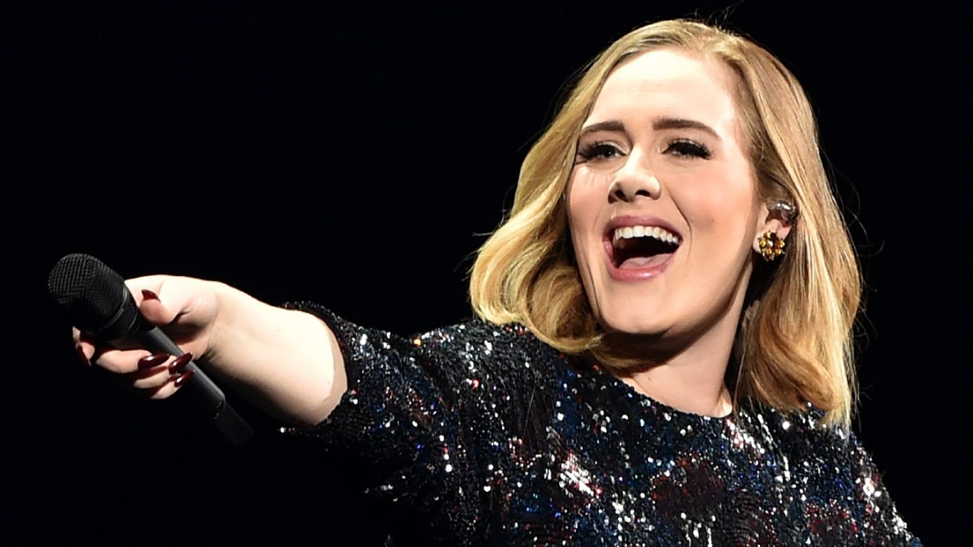 Adele surprises fans with music video announcement in show-stopping new look
