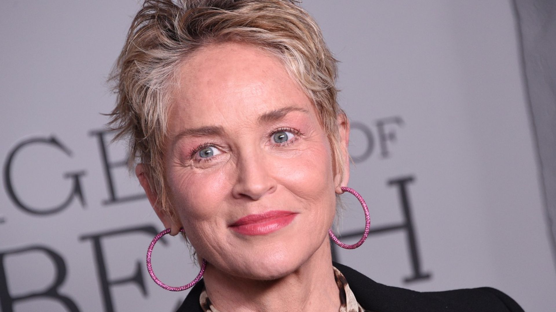 Sharon Stone turns up the heat as she shows off stunning physique in lingerie and heels