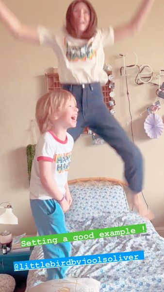jools-oliver-jumping-on-bed-with-son-river