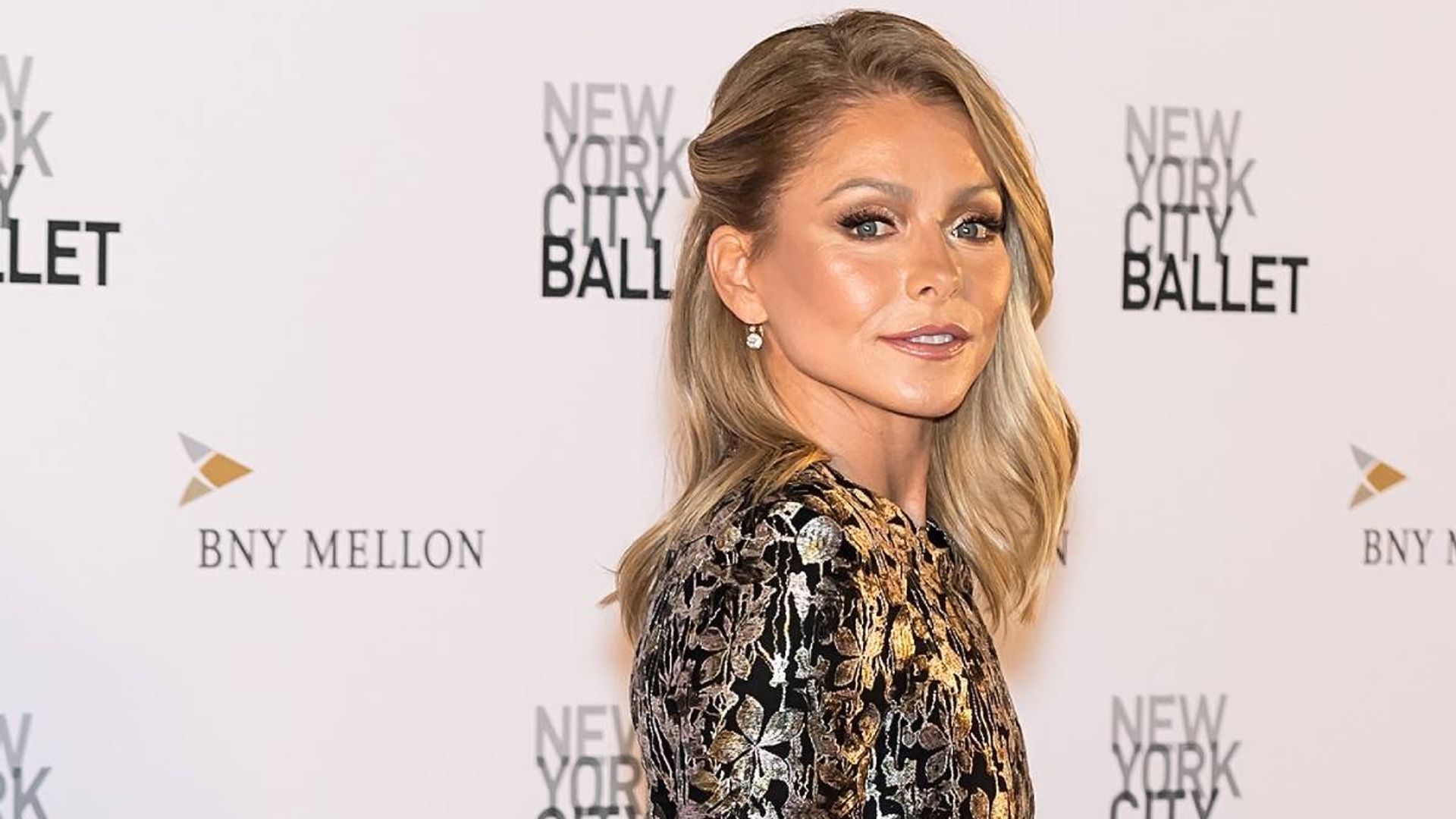 Kelly Ripa explains recent absence from LIVE! with cheeky pictures from unexpected location