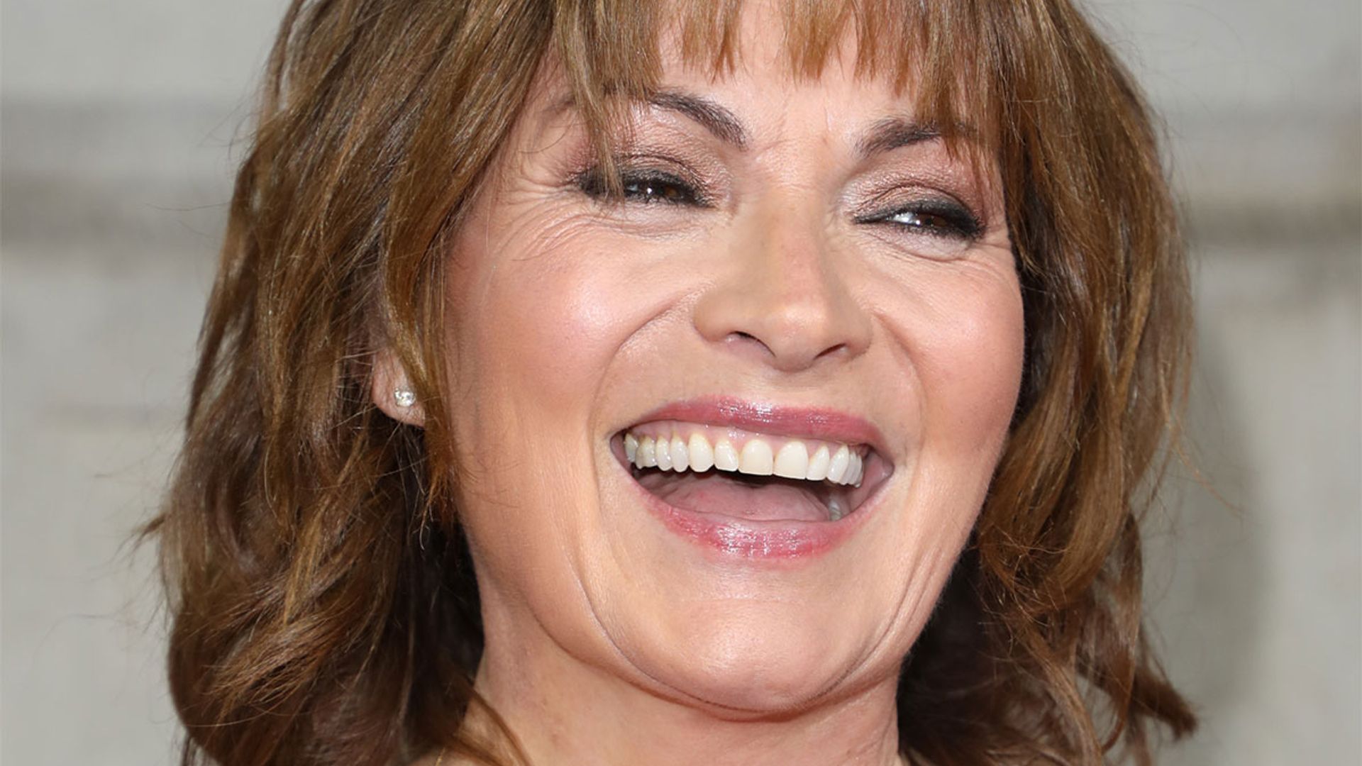 Lorraine Kelly's yellow shirt dress has springtime style written all over it