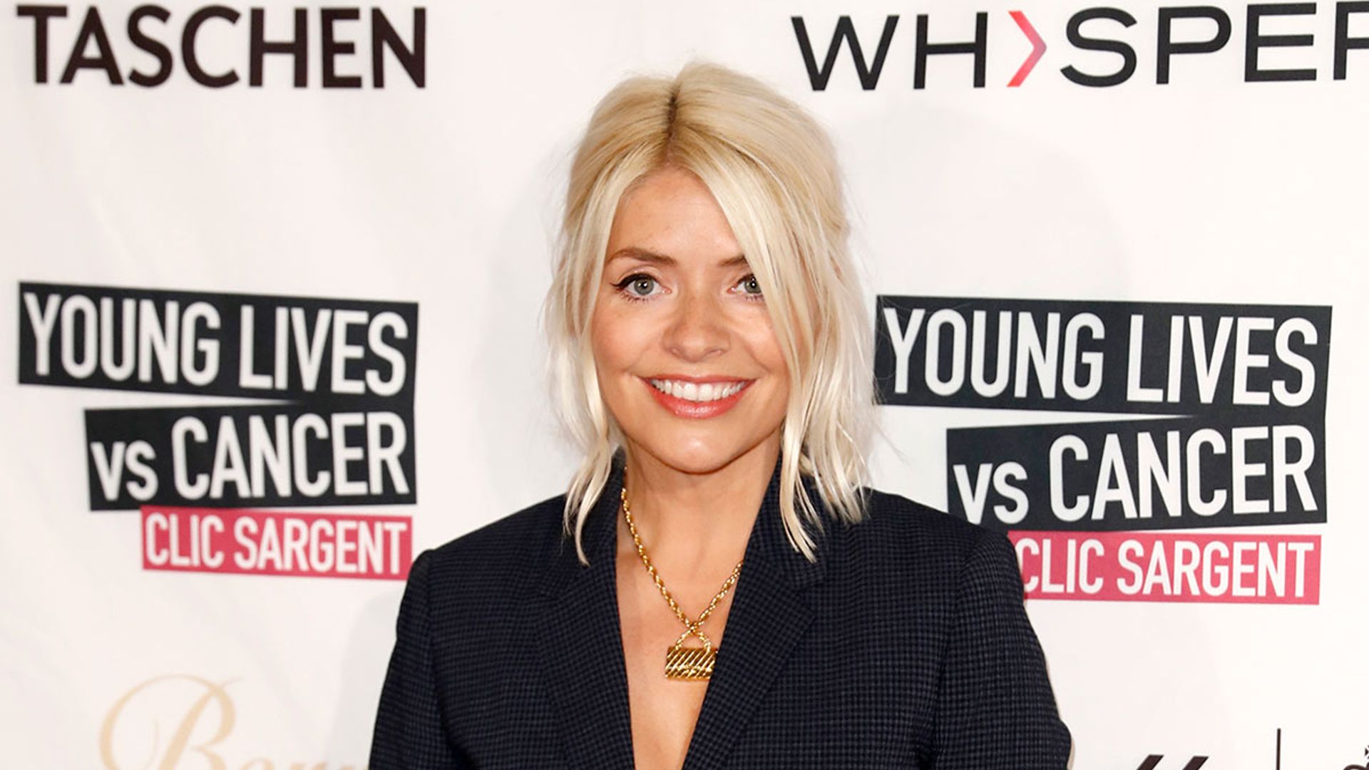 Holly Willoughby wears a leather skirt on This Morning.