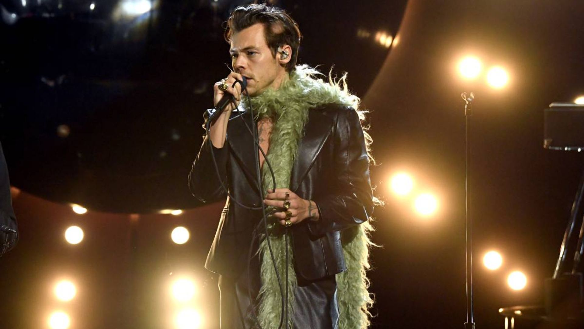 Harry Styles had a love affair with feather boas at the 2021 Grammys