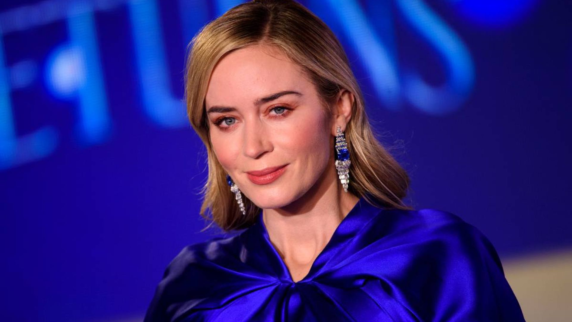 Emily Blunt stuns in a hot pink Gucci blouse we want in our closets right now