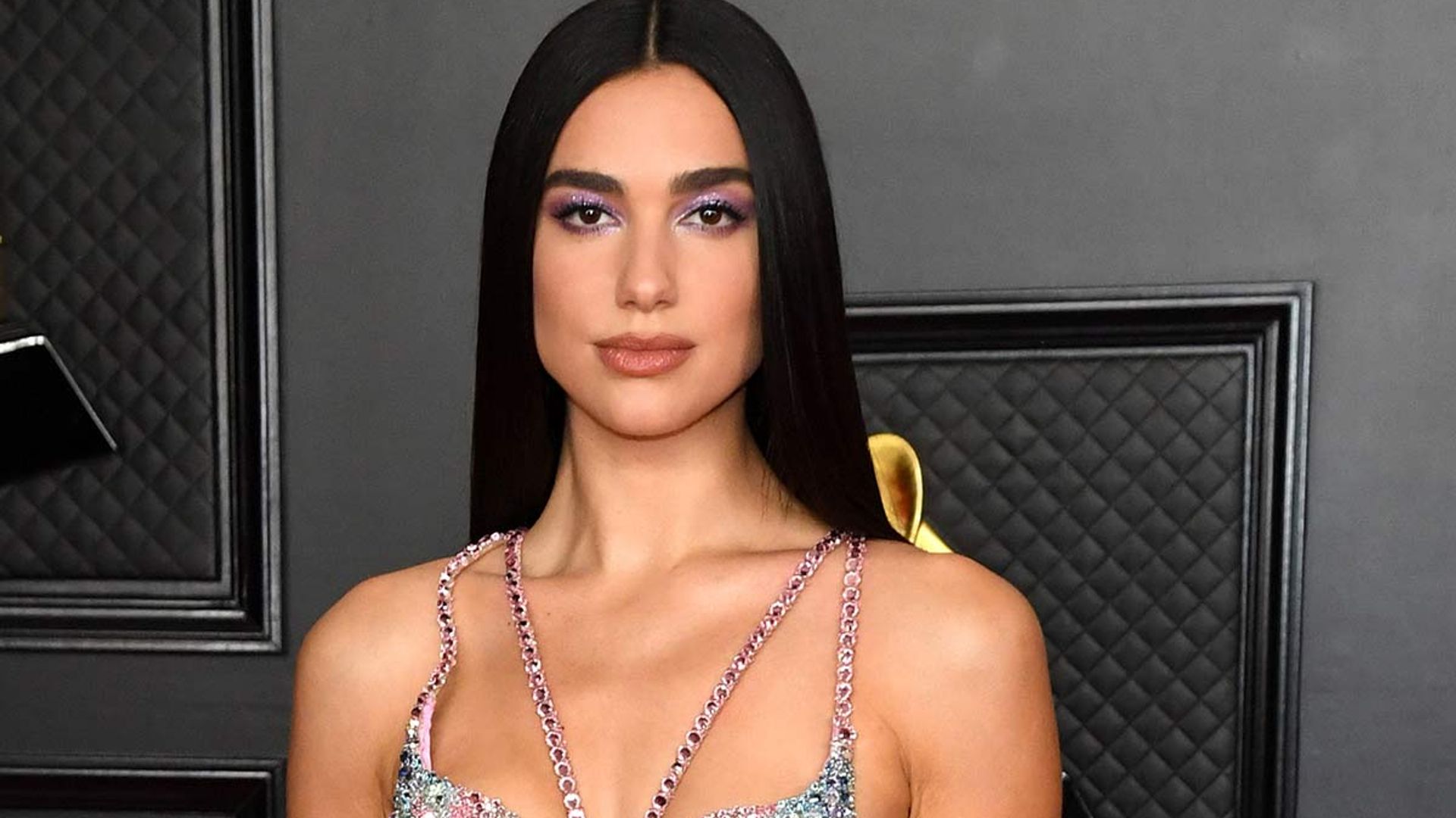 Dua Lipa commands attention in daring thigh-split skirt and ab-baring crop top