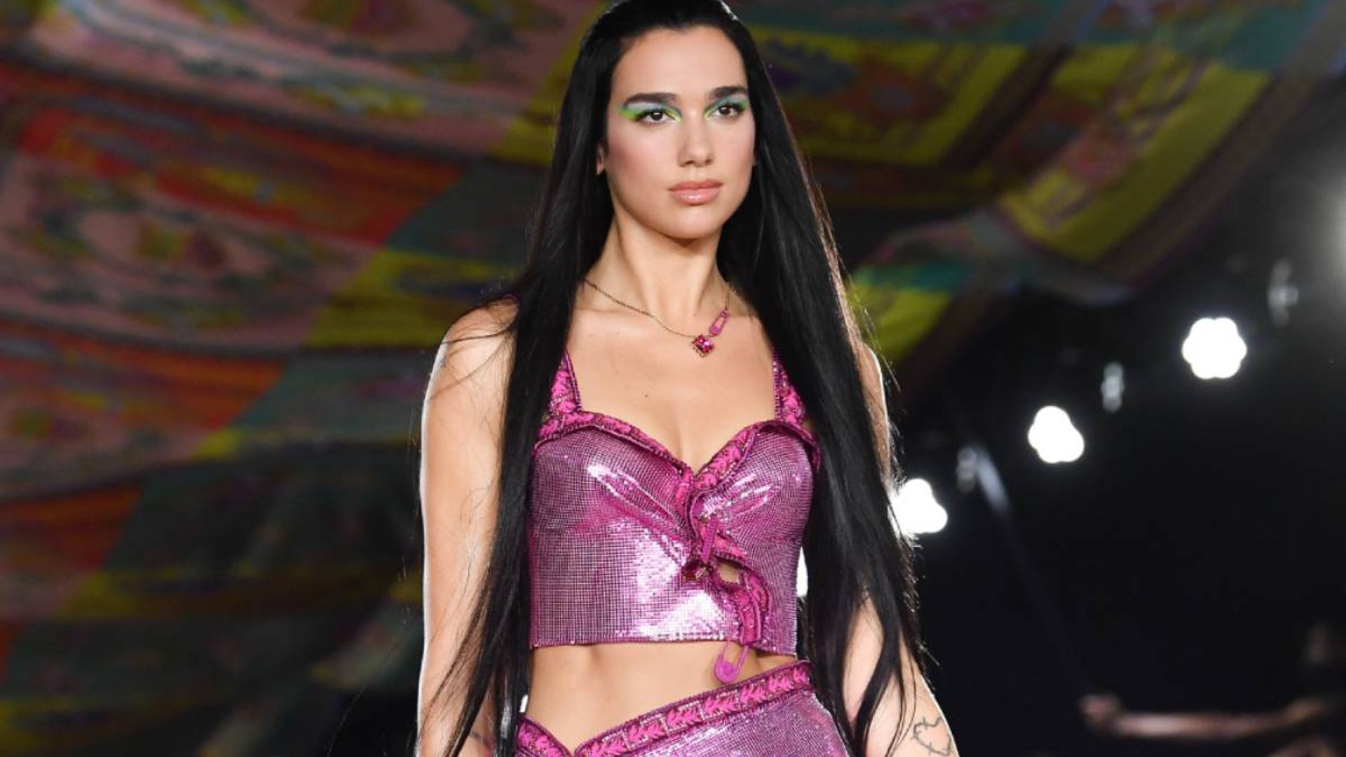 Dua Lipa gives Angelina Jolie vibes with a daring dress and glam hair transformation