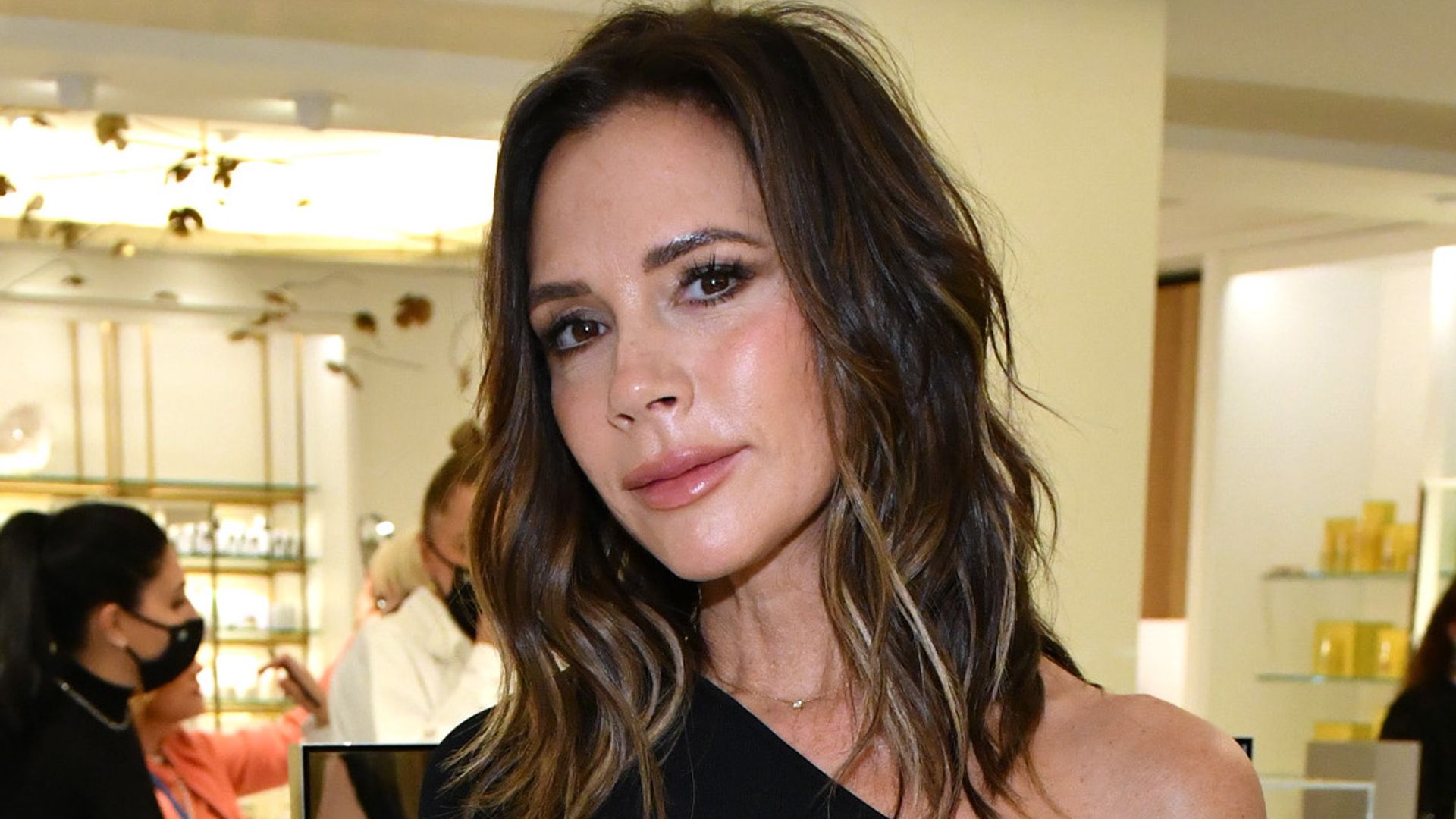 Victoria Beckham is the definition of spicy in her body-hugging black dress