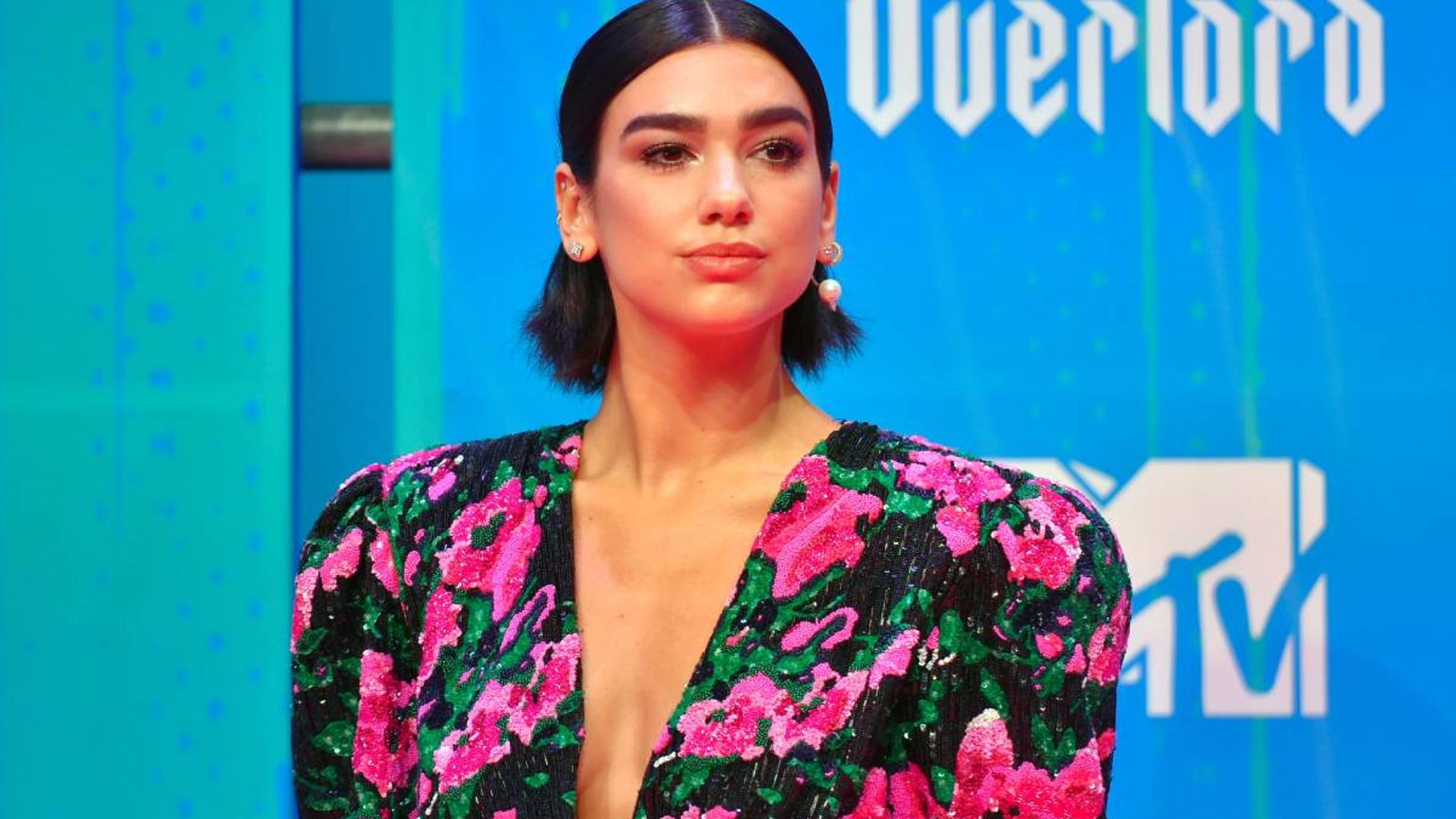 Dua Lipa turns heads in a lace-up top - and wait until you see her pants