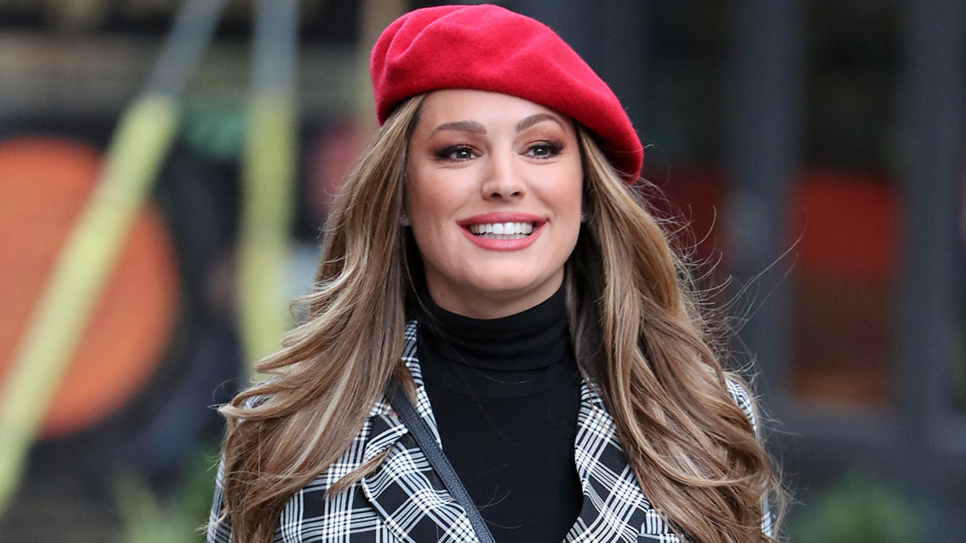 Kelly Brook is flawless in stunning festive mini-dress and tights