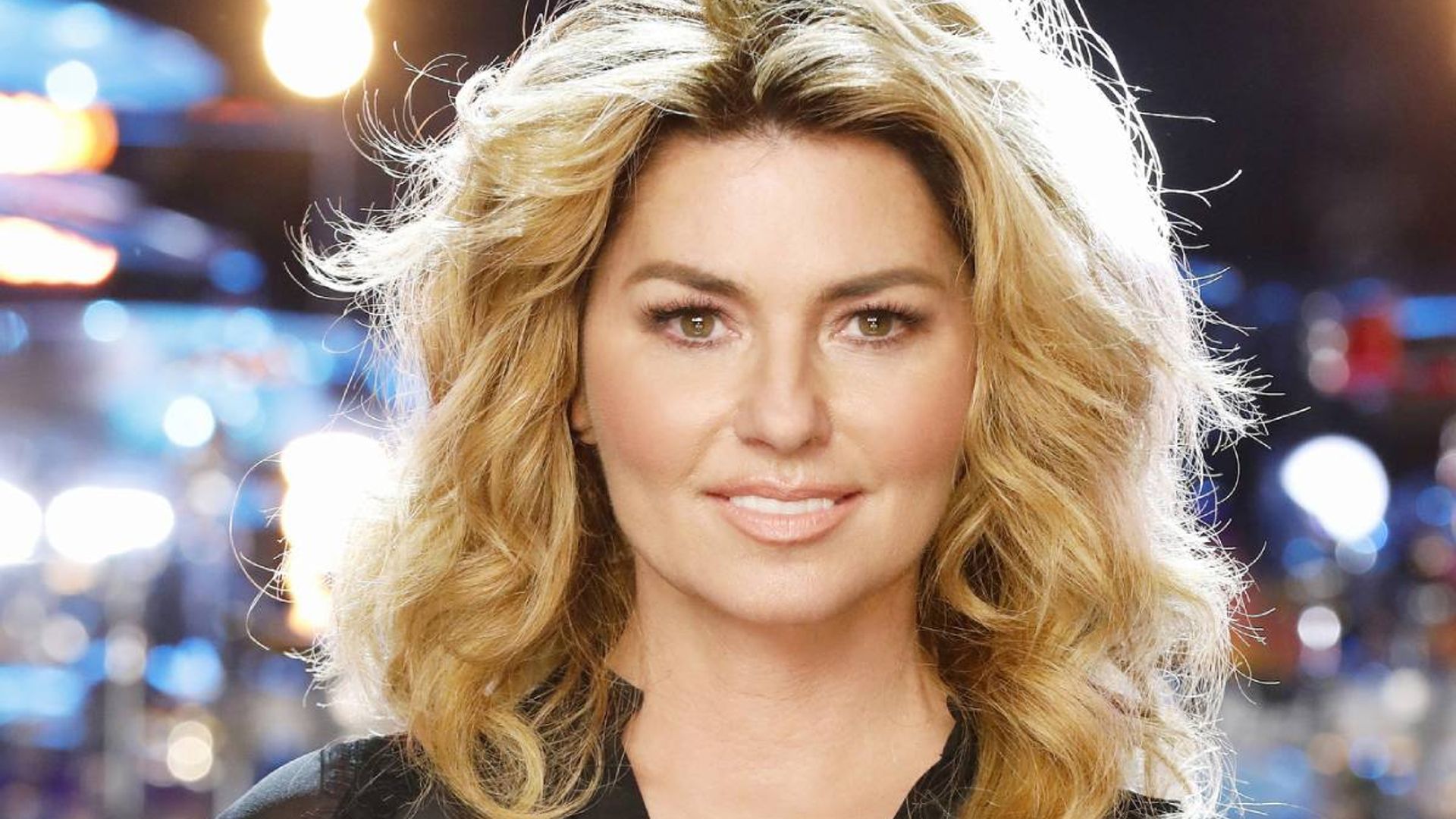 Shania Twain looks like a real life princess in metallic pink gown in celebratory stage photo