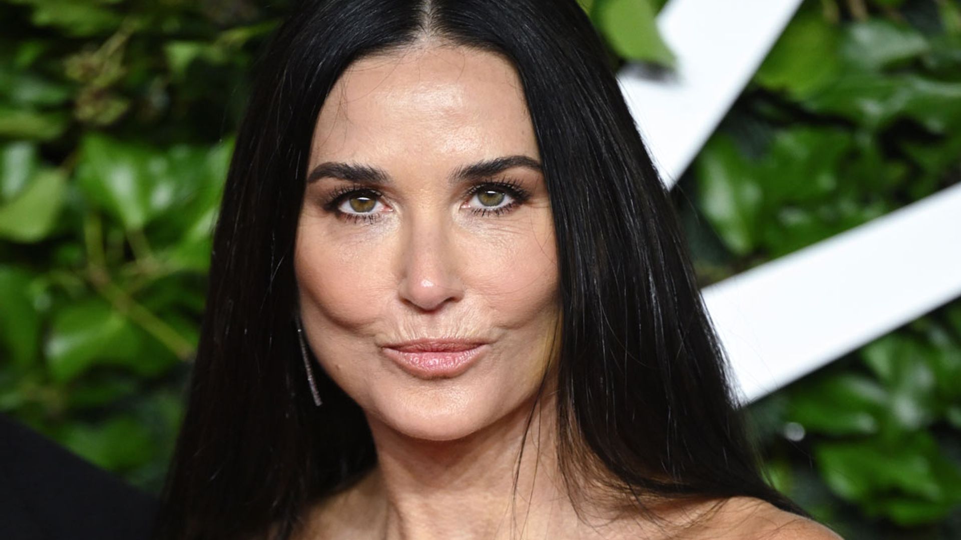 Demi Moore's glamorous airport style turns heads as she returns home for the holidays
