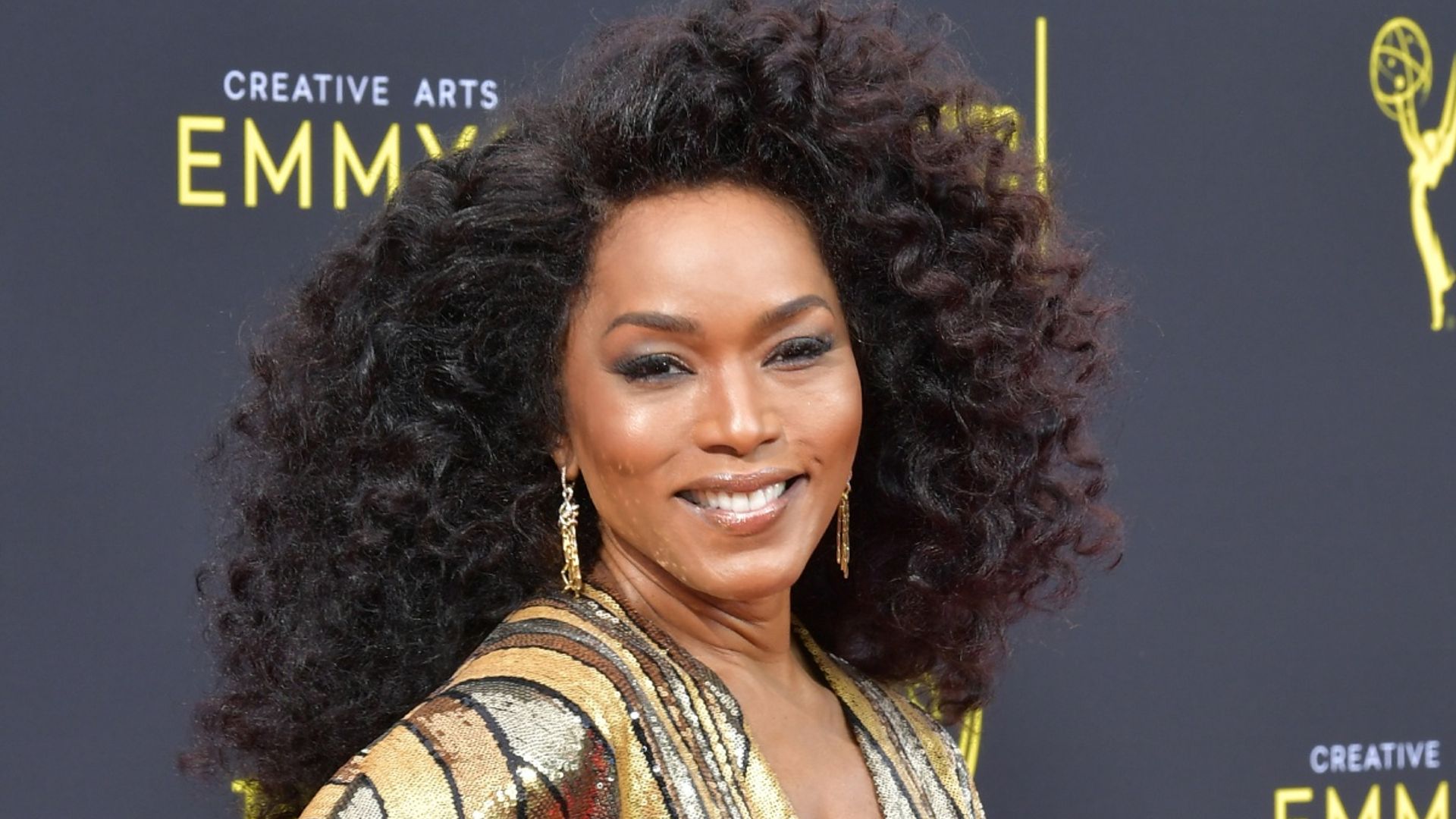 Angela Bassett stuns in the most regal and extravagant purple gown you need to see