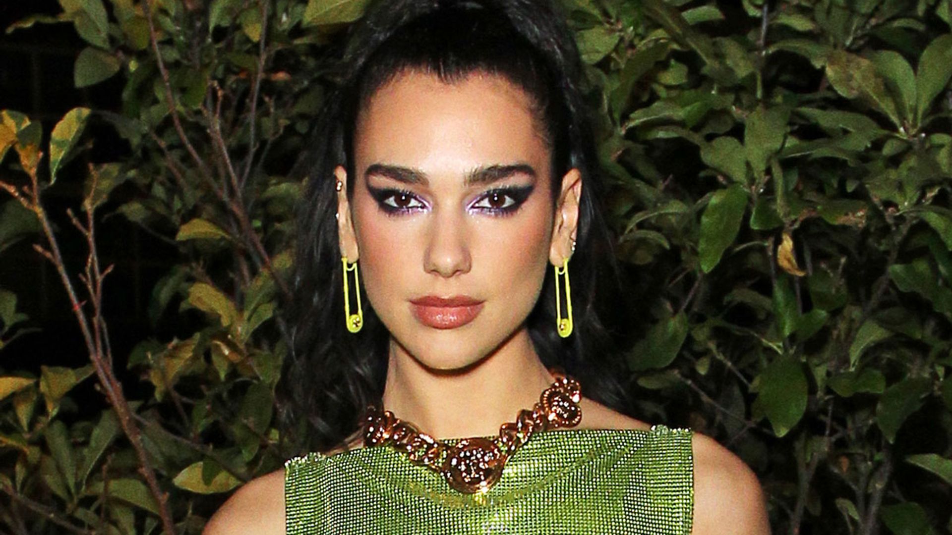 Dua Lipa levels up her look in leather mini dress and thigh-high boots