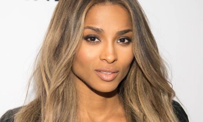 Ciara smoulders in black gown in romantic beach video with Russell Wilson
