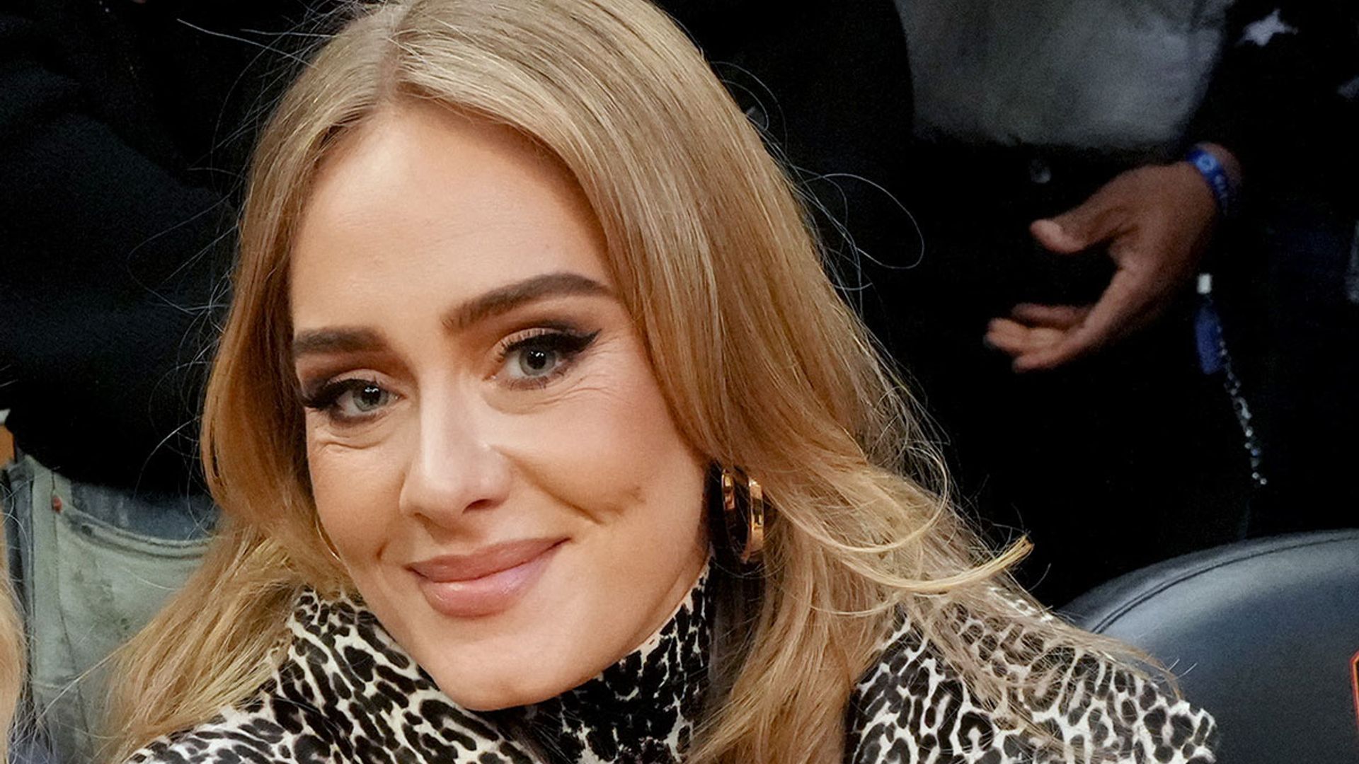 Adele cosies up to boyfriend in an outfit that will seriously astound you