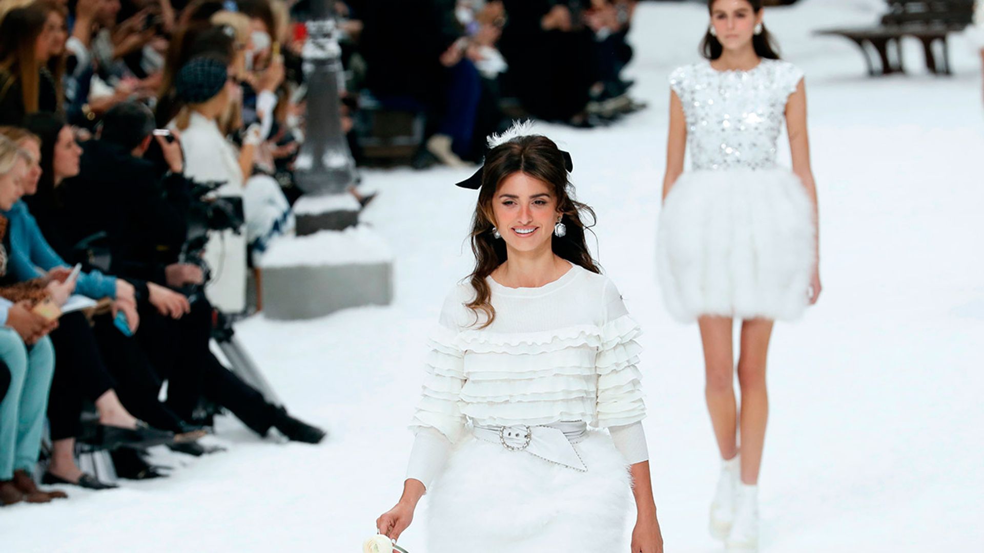 Penelope Cruz walks the Chanel AW19 catwalk carrying a white rose in tribute to Karl Lagerfeld