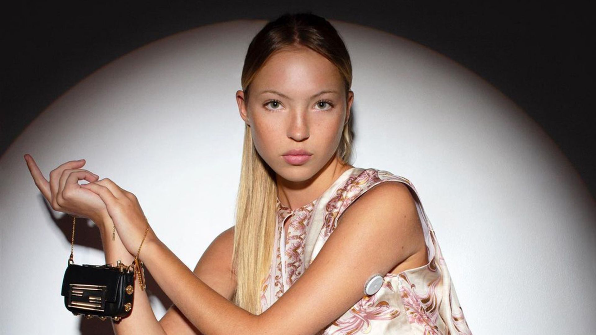 Lila Moss shows her diabetes monitor in picture for latest Fendi and Versace collab campaign