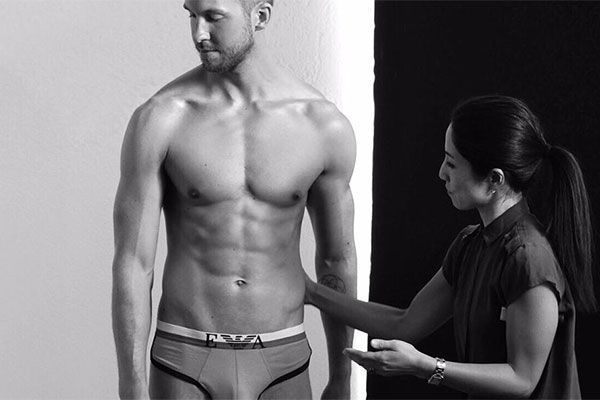 Calvin Harris Flexes His Eight-Pack Abs While Modeling 