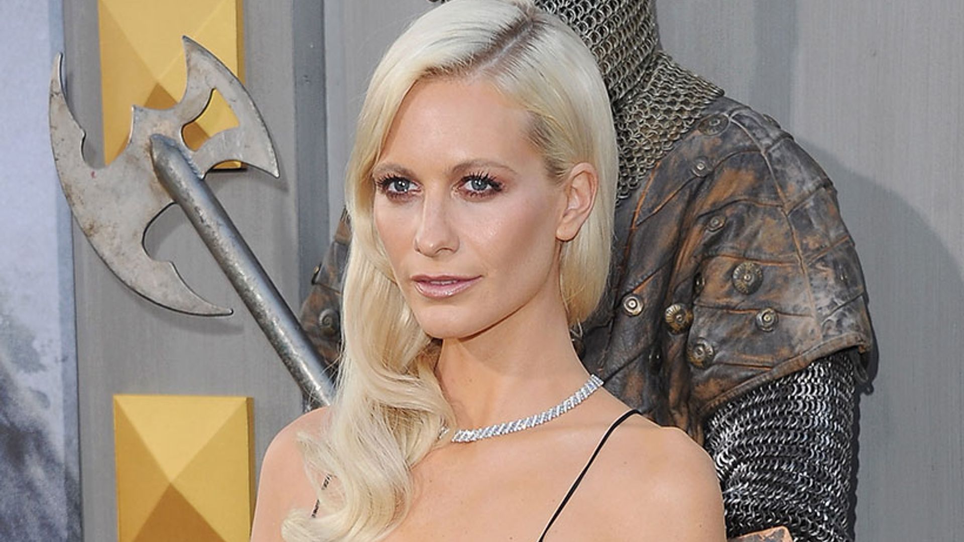 Poppy Delevingne oozes elegance in plunging black gown at King Arthur premiere