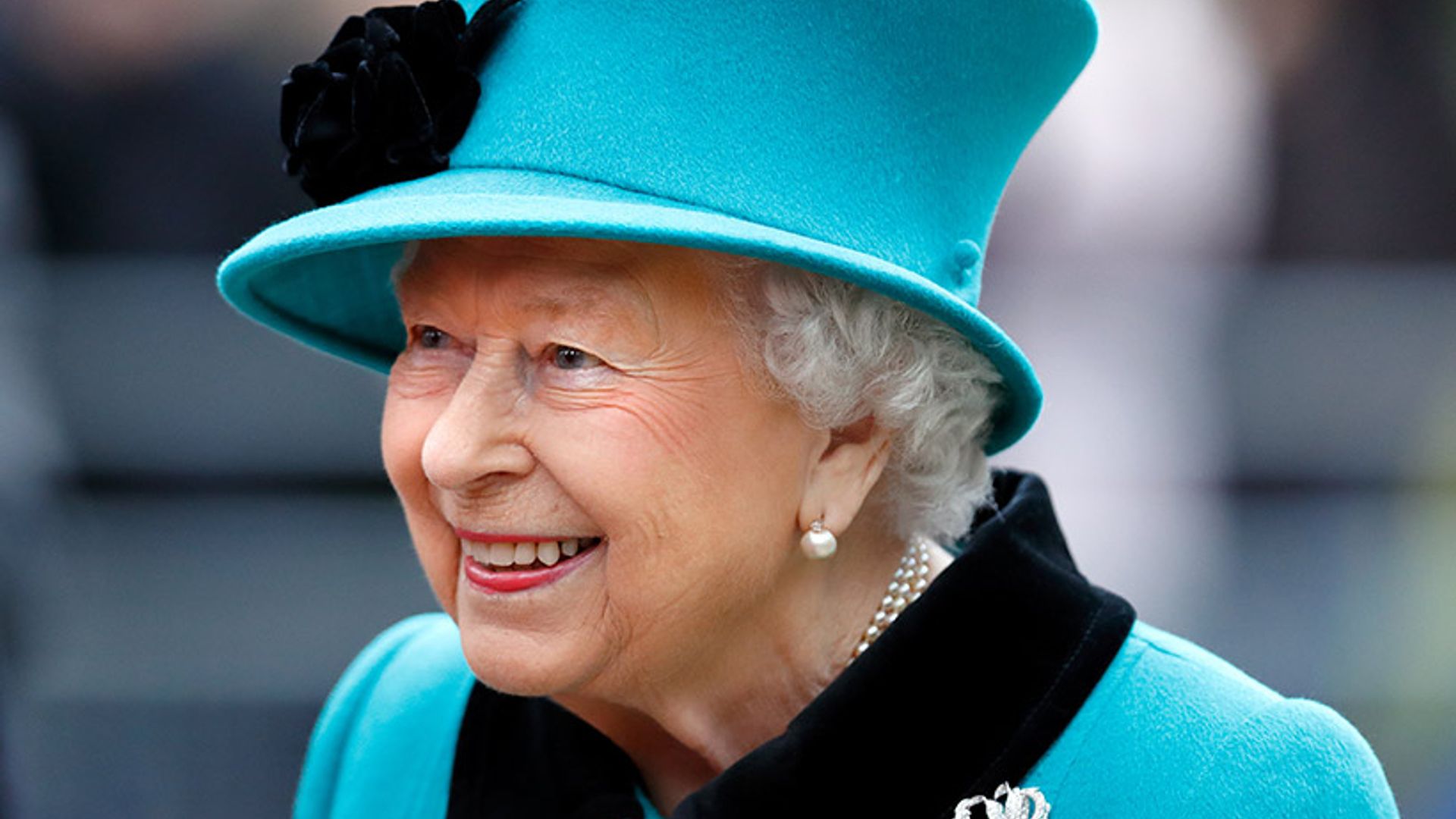 The Queen surprises in the ultimate Burberry accessory and we just love it
