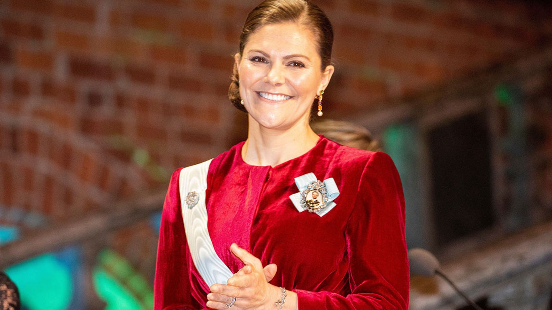 Lady in red! Crown Princess Victoria dazzles at Stockholm banquet in regal red gown