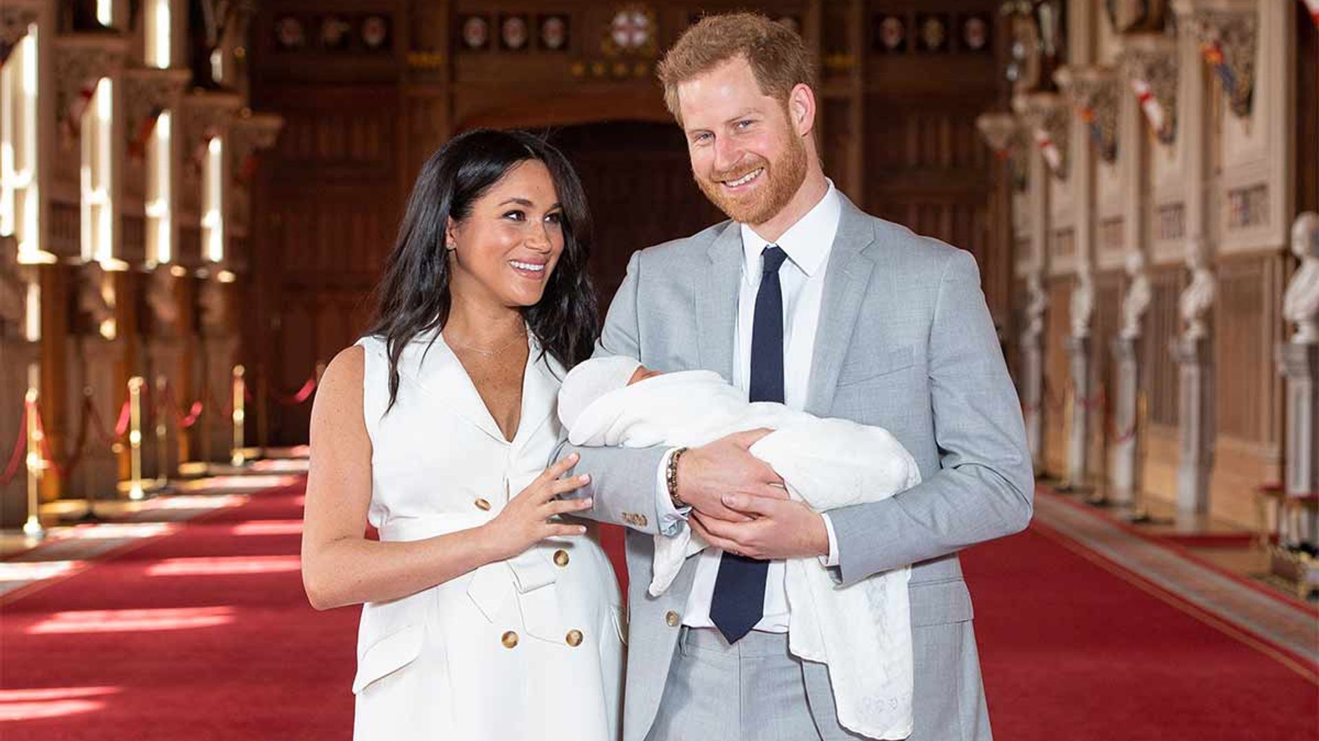 New mum Meghan Markle introduces her son dressed in young British designer
