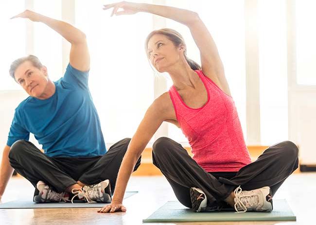 woman-exercising-yoga-class