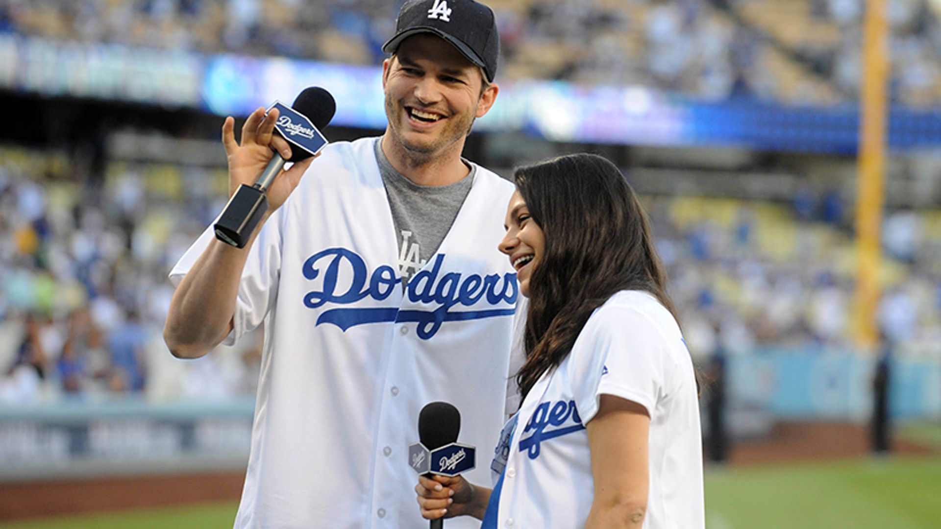 Mila Kunis shows off beautiful baby bump on sporty date with Ashton Kutcher