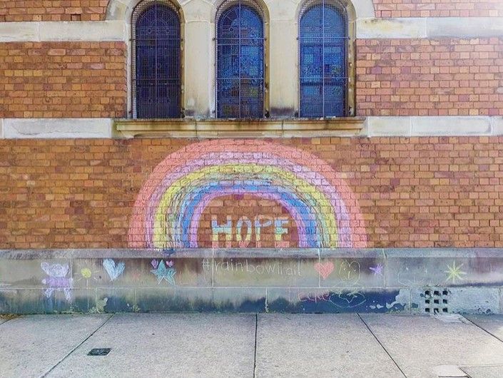 Image of church in Australia where residents decorated the side of the church by drawing a rainbow in chalk