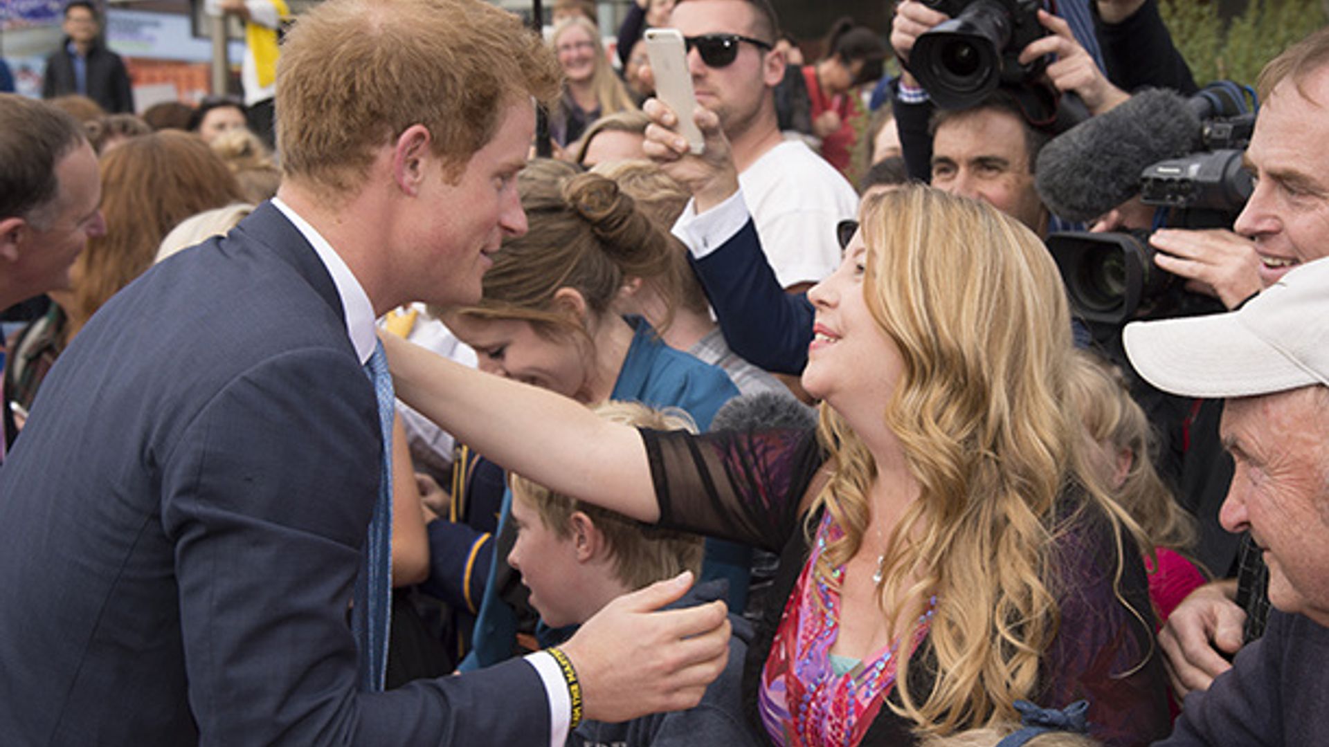 Prince Harry given presents for Princess Charlotte, reunites with old teacher