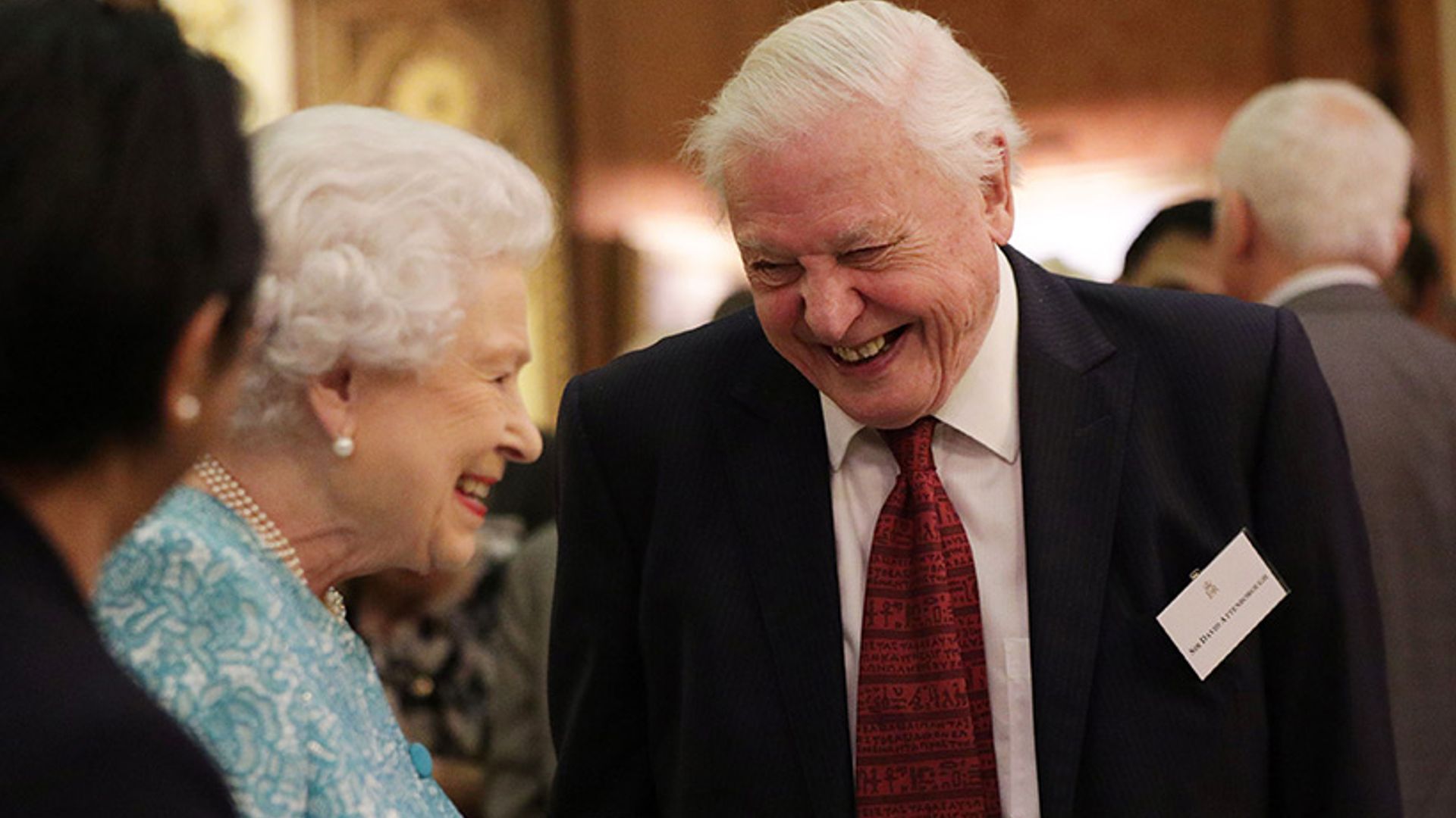 Sir David Attenborough laughing with the Queen