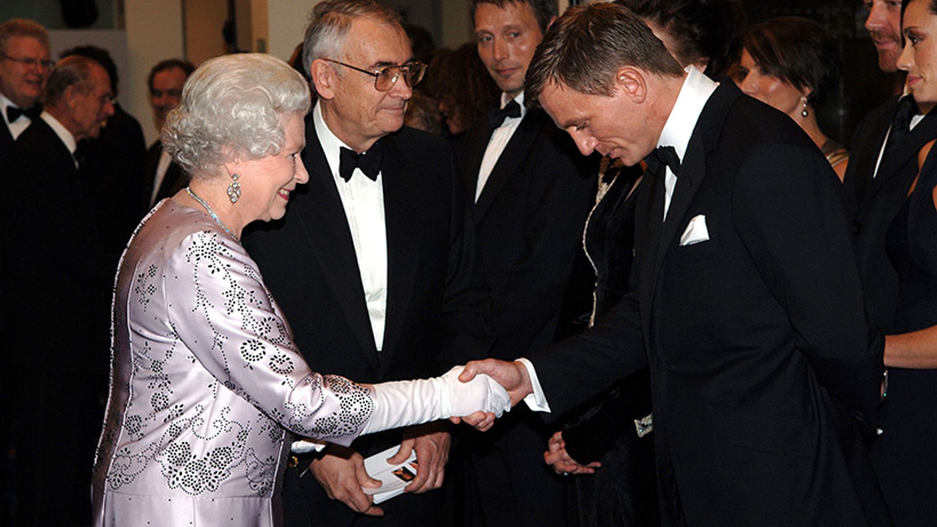 The Queen shaking Daniel Craig's hand