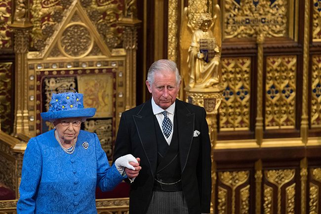 the queen and prince charles looking sombre