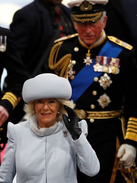 prince charles walks behind duchess of cornwall
